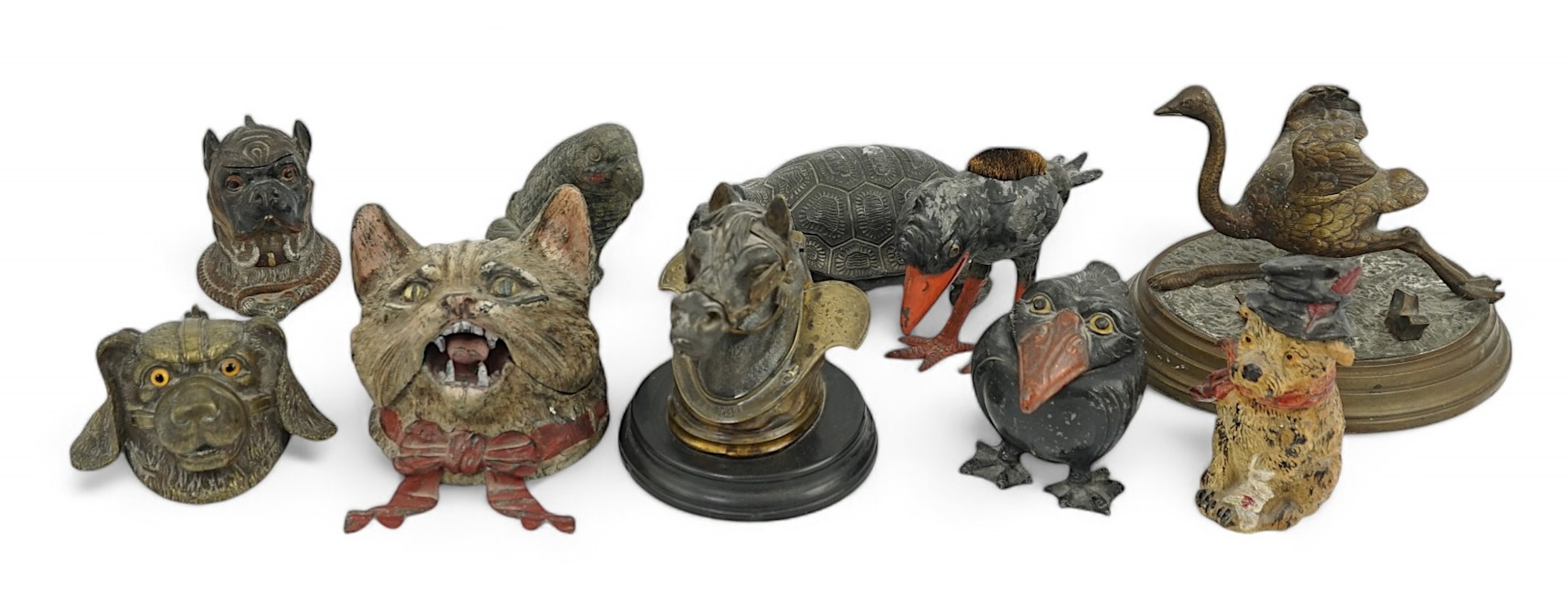 A collection of nine 19th and 20th century novelty animal bronze and metal ink wells, including a Martin Brothers-style ‘Wally’ inkwell. Condition - minor chips due to use and age